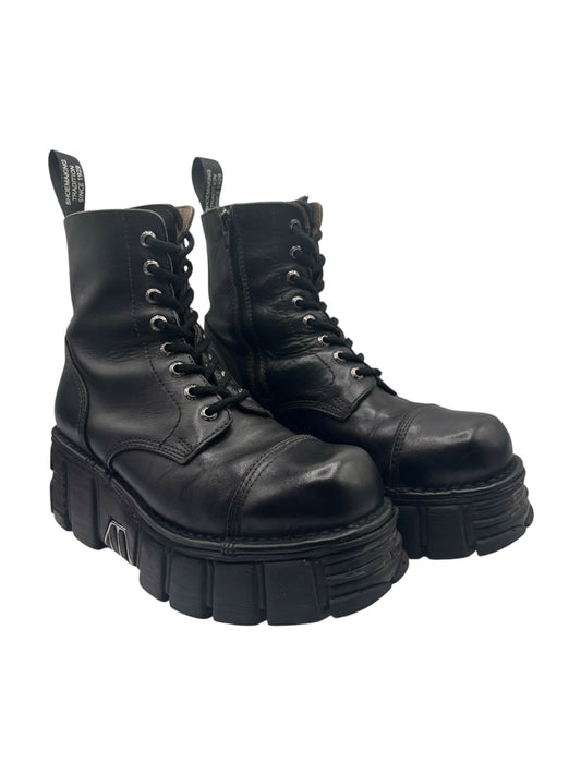 Black leather lace-up platform boots with stacked sole and side pull tabs