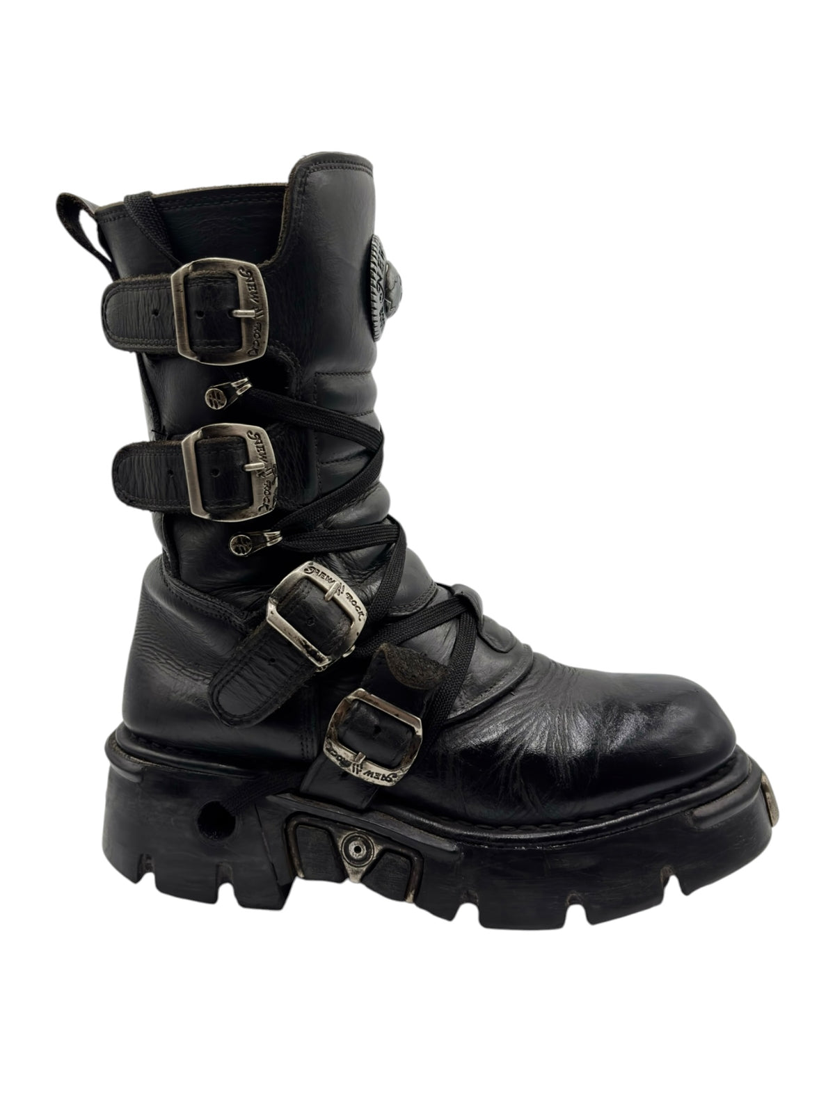 Black mid-calf boots with overlapping straps, metal buckles, and padded shaft