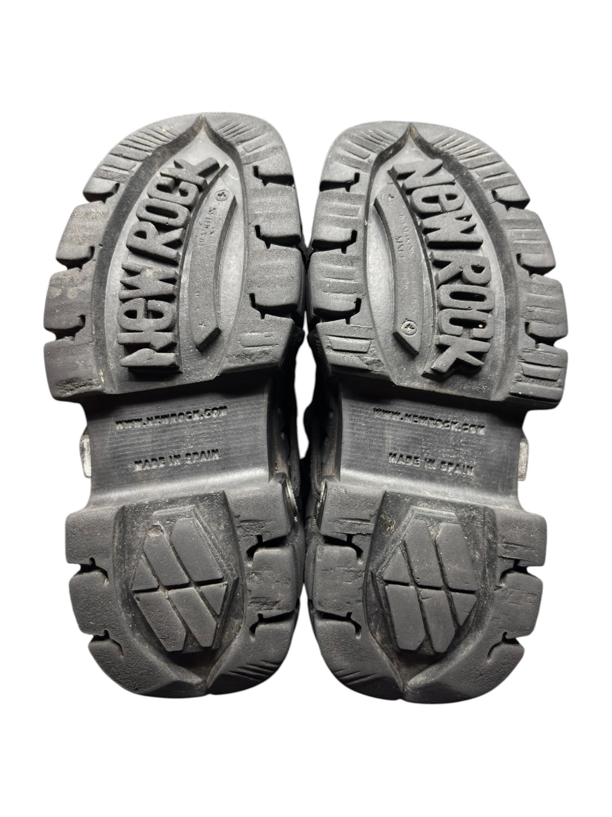 Pair of platform boots with thick treaded outsole, side-by-side view.