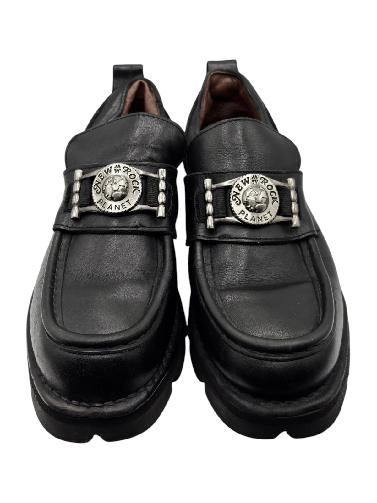 Black leather loafers with double buckled straps and chunky rubber sole