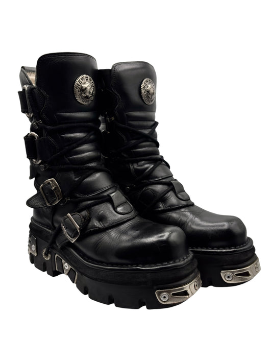Vintage mid-calf black leather lace-up boots with buckles, straps, and chunky sole