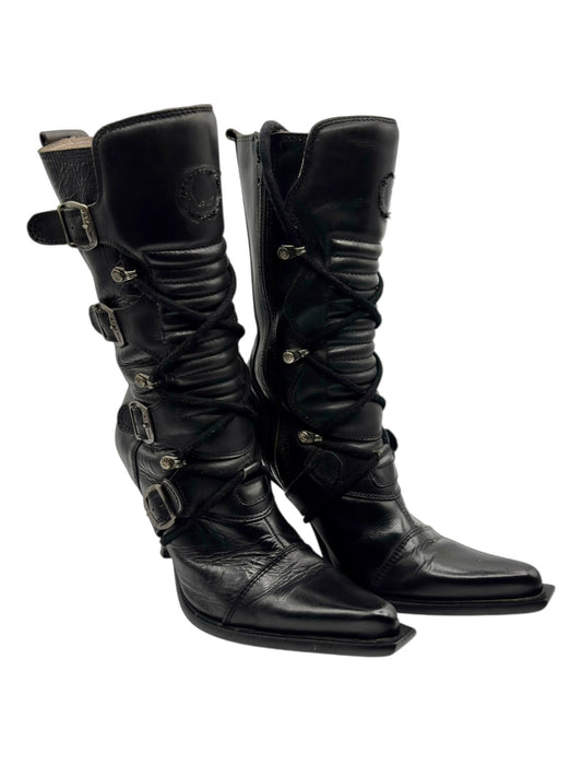 Black mid-calf leather biker heel boots with buckled straps and front lacing.