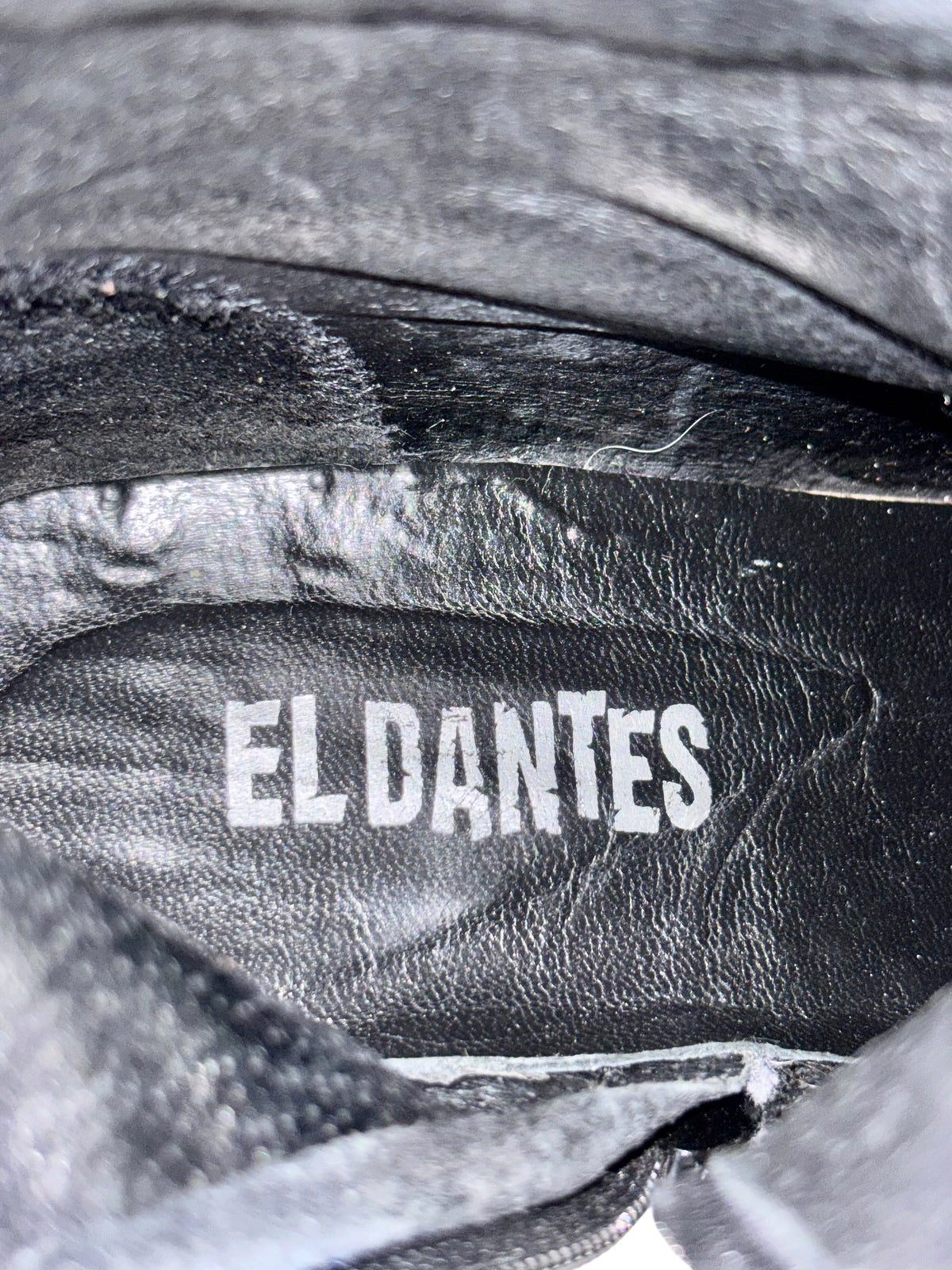 Black leather knee-high boot interior lining with EL DANTES logo