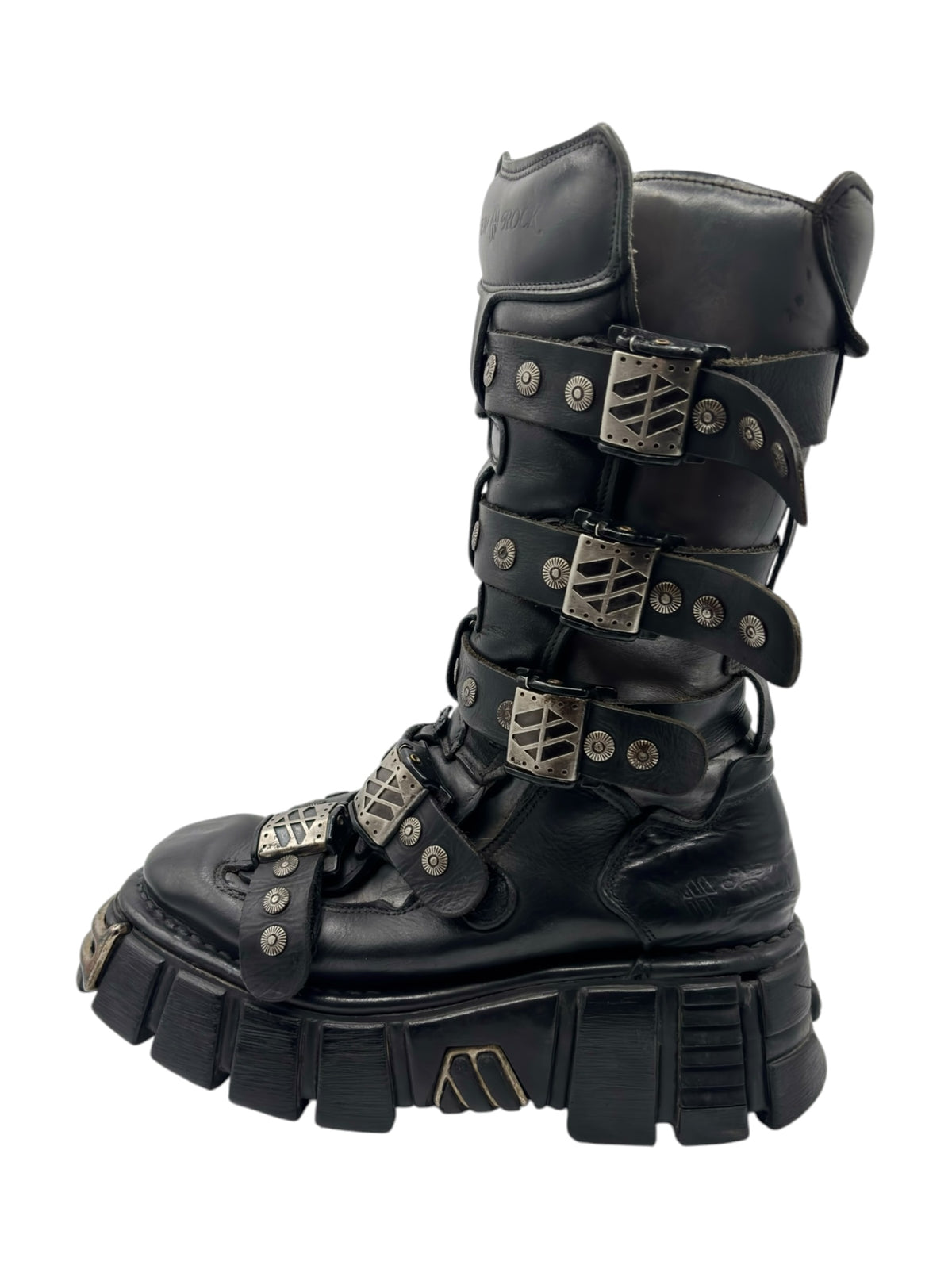 Black studded strap boots with multiple buckle straps and chunky tread sole