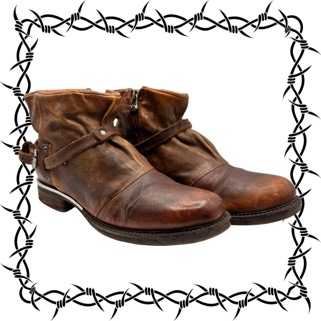 Brown leather vintage ankle boots with side zipper and rugged stitched sole