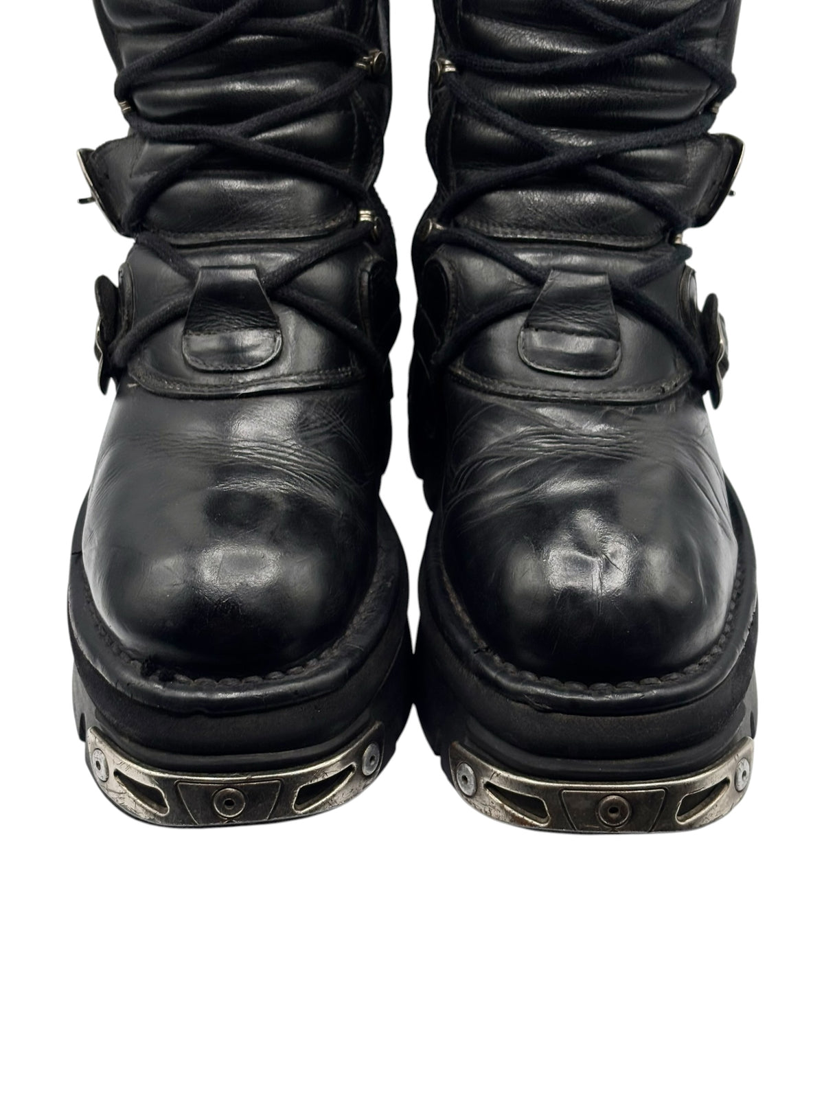 Bottom view of black mid-calf reactor boots showing durable tread plates