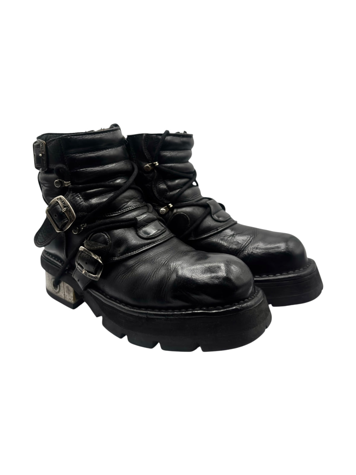 Black leather raised-heel ankle boots with buckles and straps