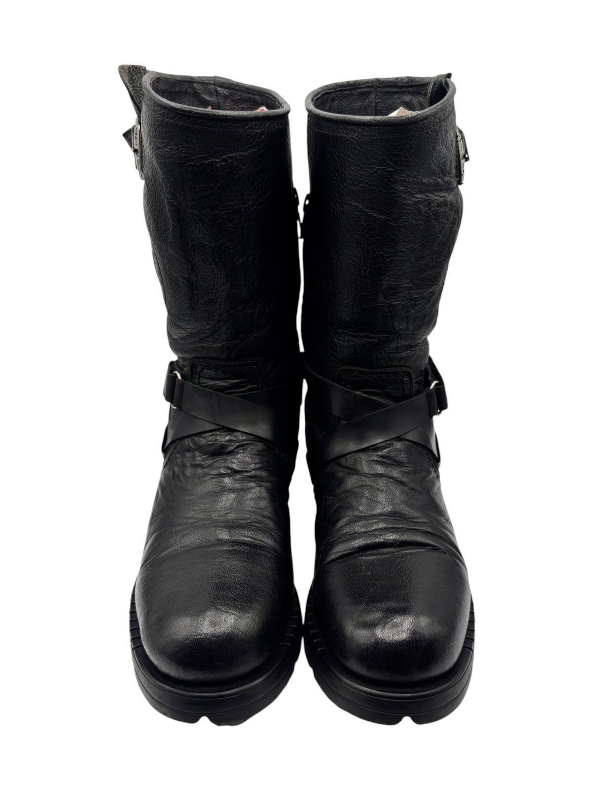 Pair of black leather biker boots with side buckle straps and chunky rubber sole