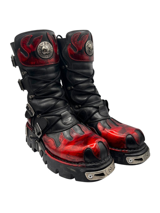 Black leather combat boots with red flame panels, metal emblem, side buckles, lug sole
