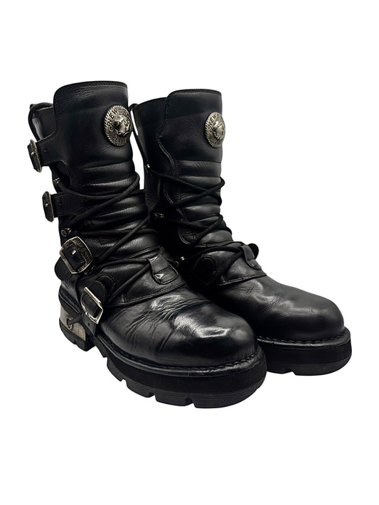 Black mid-calf leather boots with side buckle straps and raised chunky heel