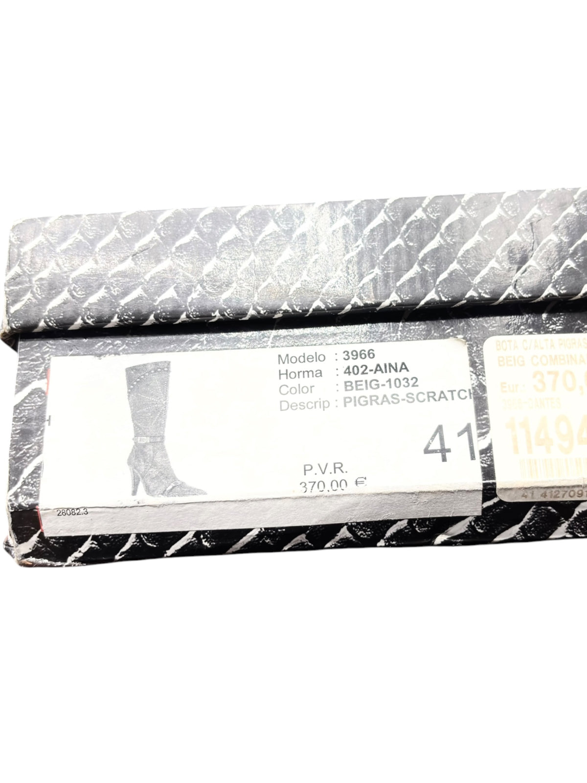 Boots label on inside lining, showing model and size details on a tag
