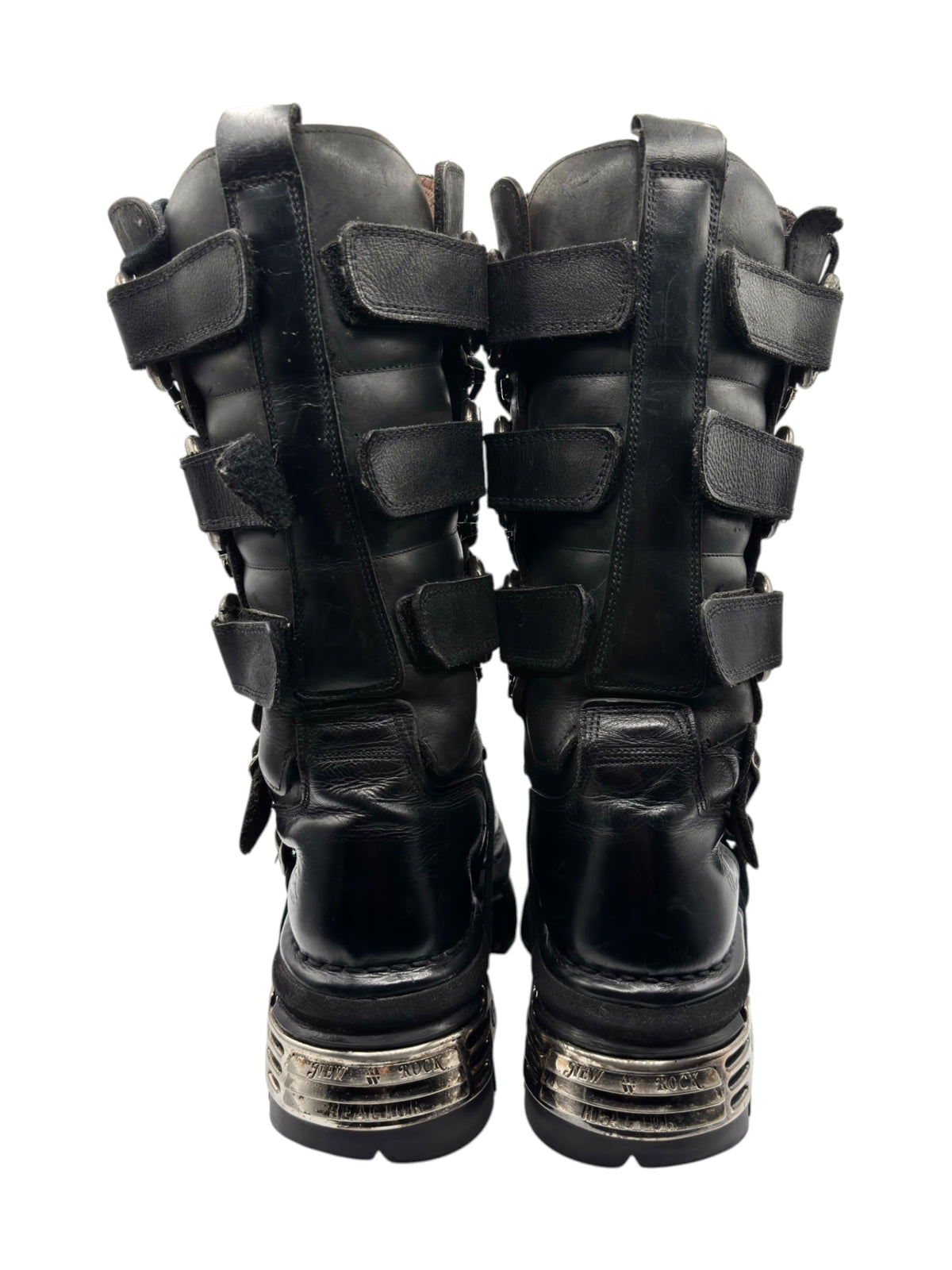 Pair of black knee-high leather boots, back view with strap loops and chunky sole