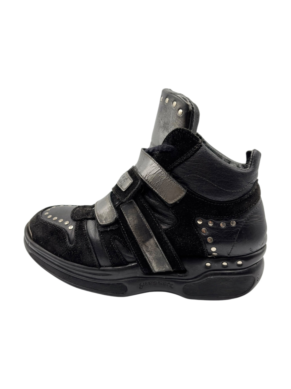 Black leather strap sneaker with double hook-and-loop straps and metal eyelets
