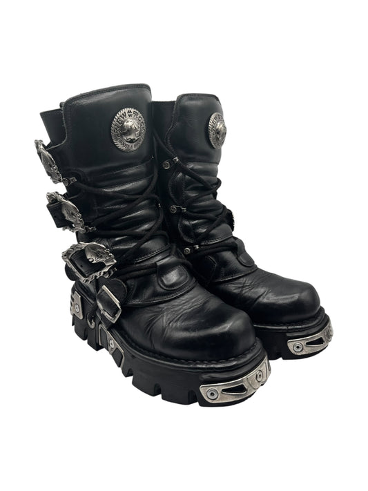 Black leather reactor boots with front buckles and layered lug sole platform