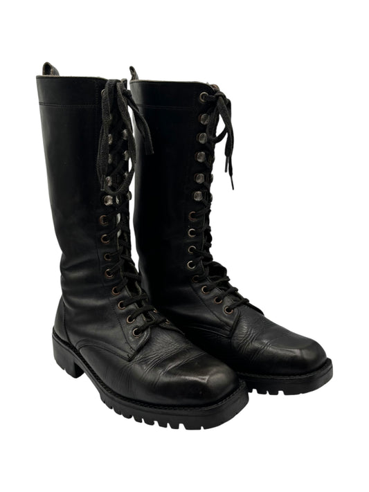 Black lace-up tall boots in angled view with front laces and chunky outsole
