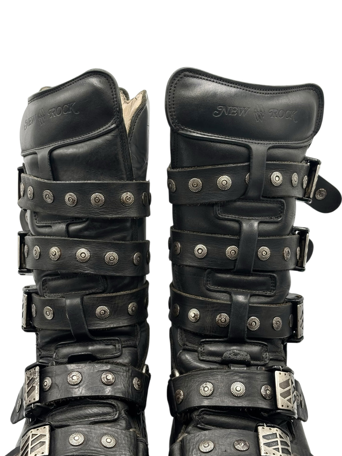 Front view of black studded strap boots with stacked buckles and chunky platform sole