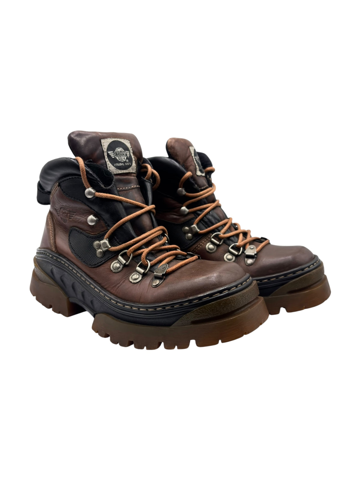 Brown leather lace-up boots, side view, black trim and chunky treaded platform sole