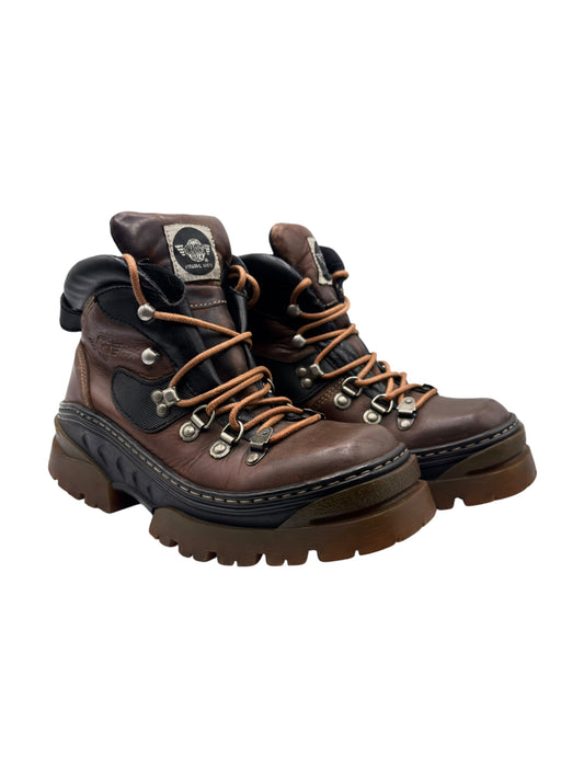 Brown leather lace-up boots, side view, black trim and chunky treaded platform sole