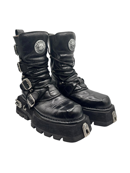 Black leather lace-up mid-calf platform boots with side buckles and round logo patch