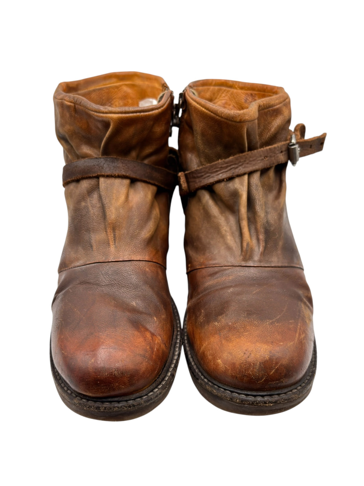 Brown leather ankle boots with cross strap and metal buckle
