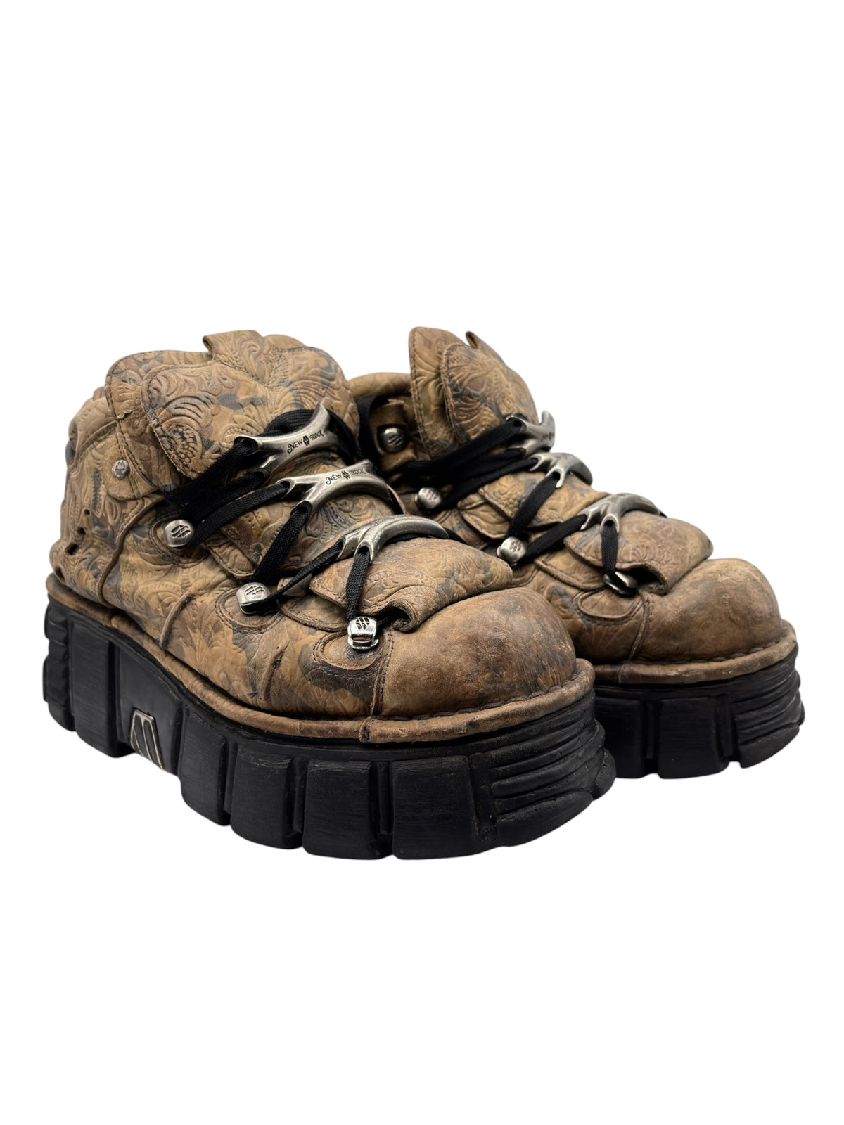 Tan-brown camo platform lace-up boots with chunky black outsole, angled view