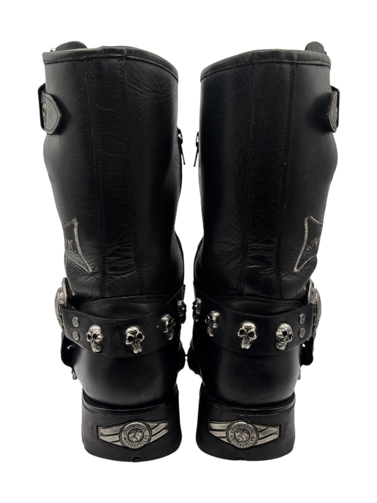 Black leather biker boots with strap and skull hardware detail
