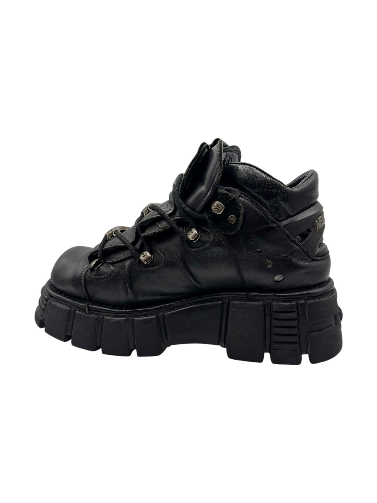Black platform boots with lace-up closure, padded collar, and stacked block sole