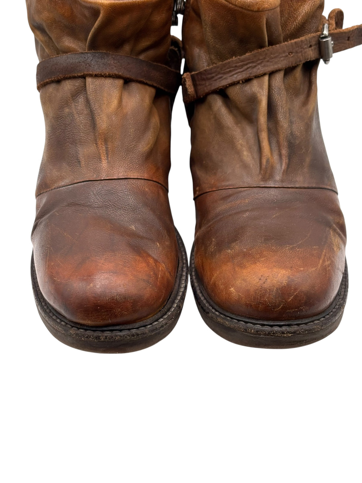 Brown leather ankle boots with distressed finish and side strap detail