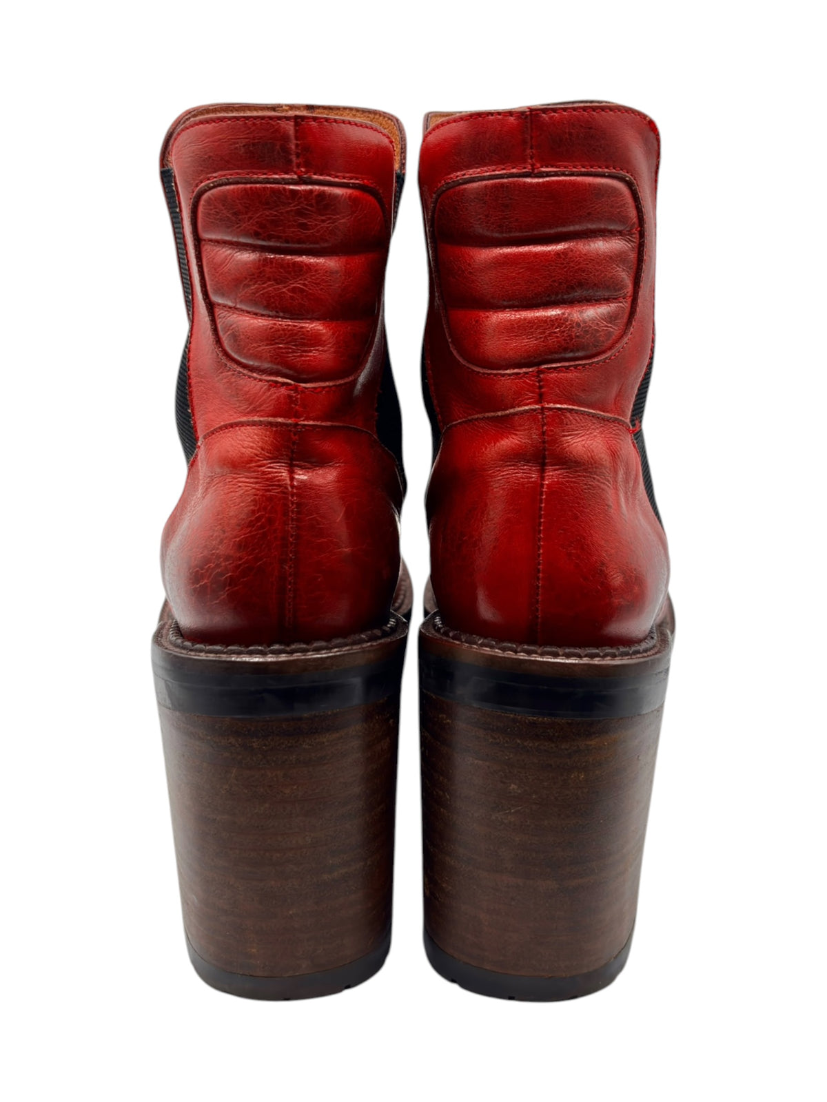 Pair of red ankle boots rear view with stacked heels and black elastic side panels