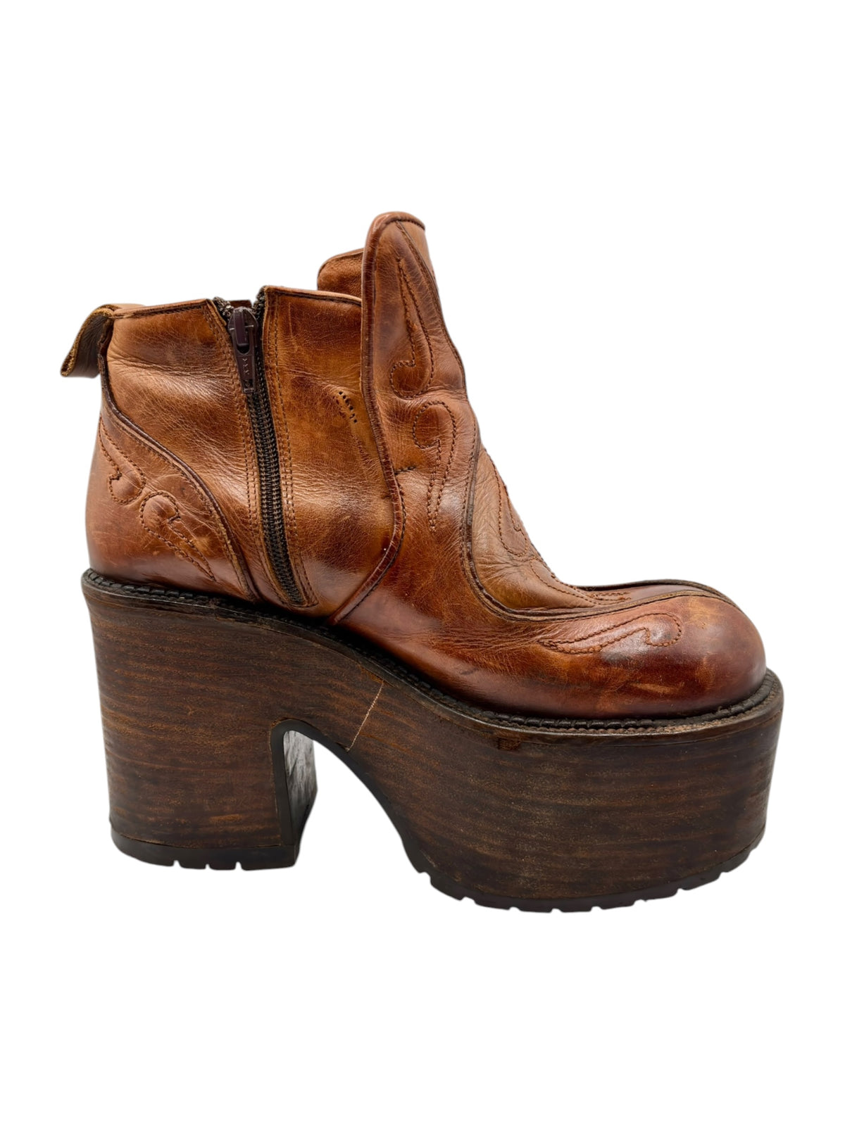 Brown leather platform ankle boots with side zipper and sculpted leather paneling
