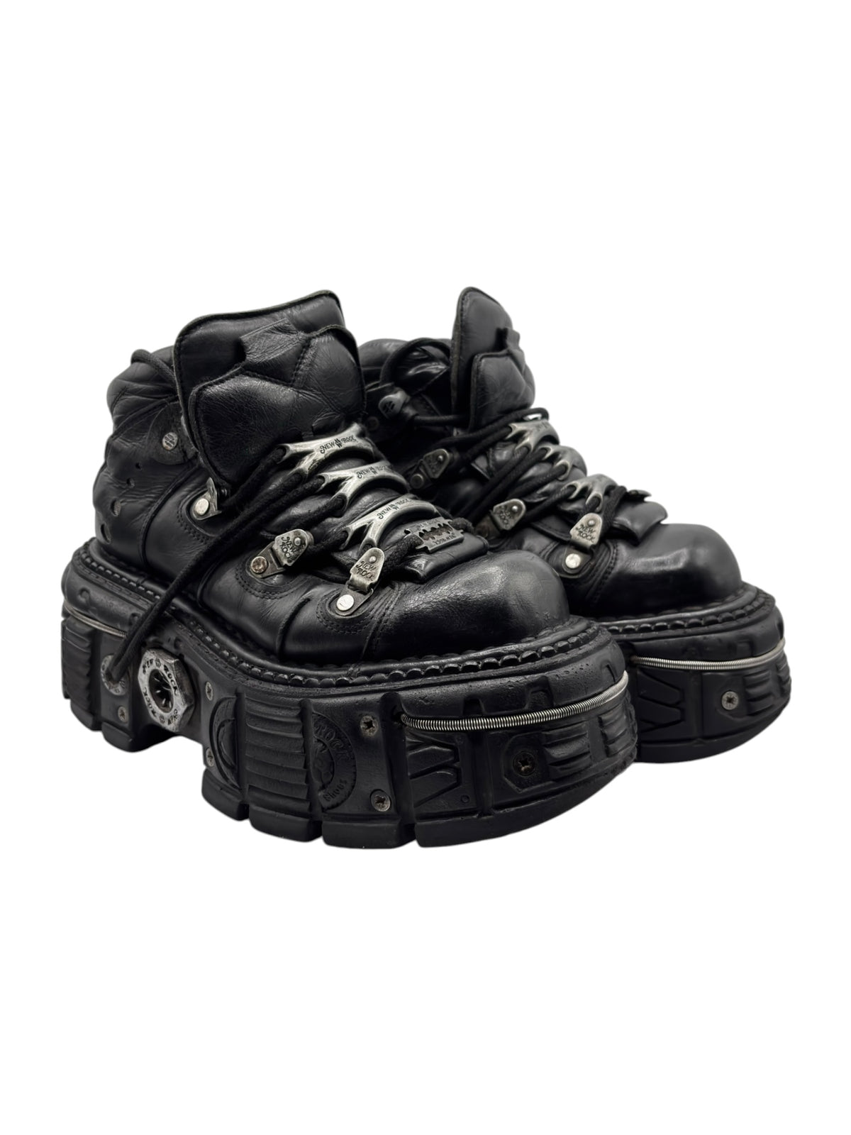 Black platform lace-up boots with chunky stacked sole and metal studs/buckles