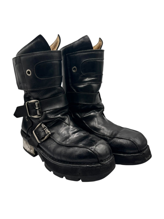 Black leather boots with side buckles, thick sole tread and raised block heel