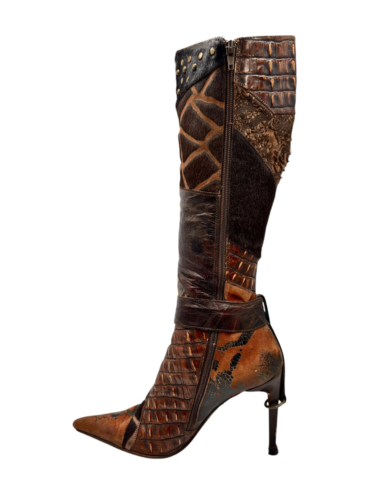 Knee-high patchwork boots with pointed toe, side zipper, and stiletto heel.