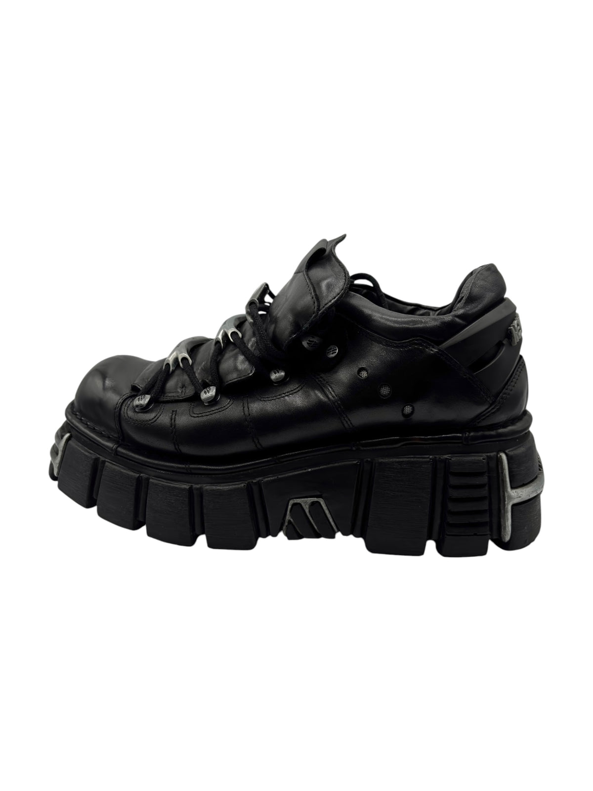 Black lace-up platform boot with thick ridged sole and metal eyelets