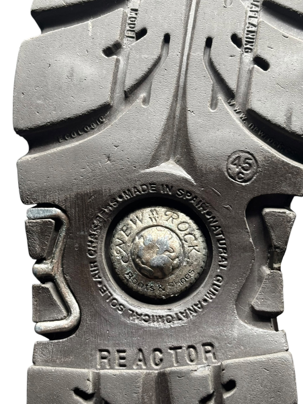 Reactor logo and made-in-Spain stamp on chunky boot sole with deep tread