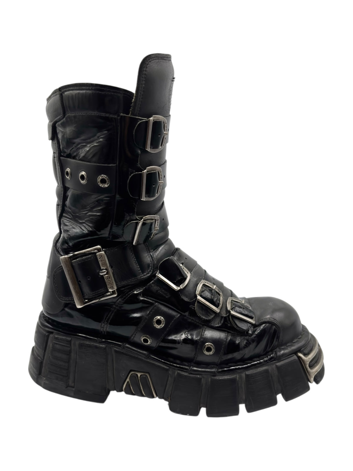 Vintage black leather boot angled view with front and side buckle straps