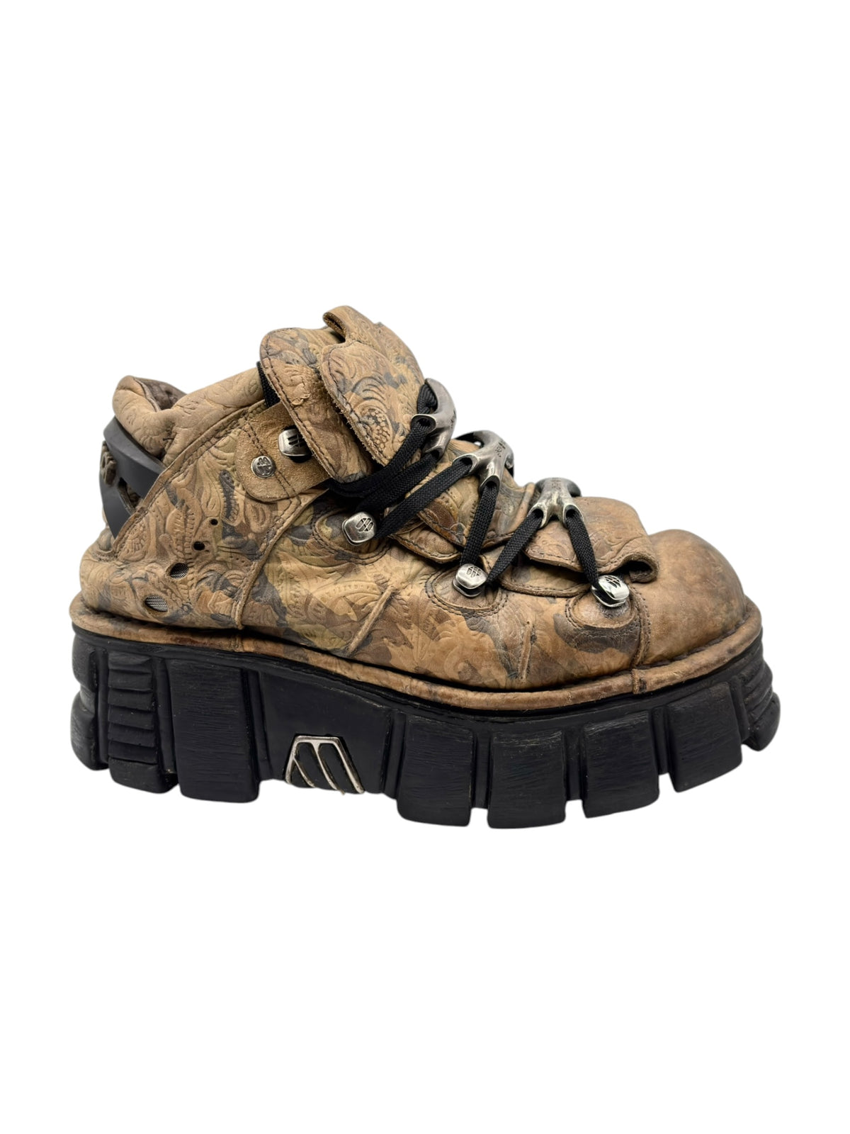 Tan-brown camo platform boots with lace-up front, rugged black sole and lift