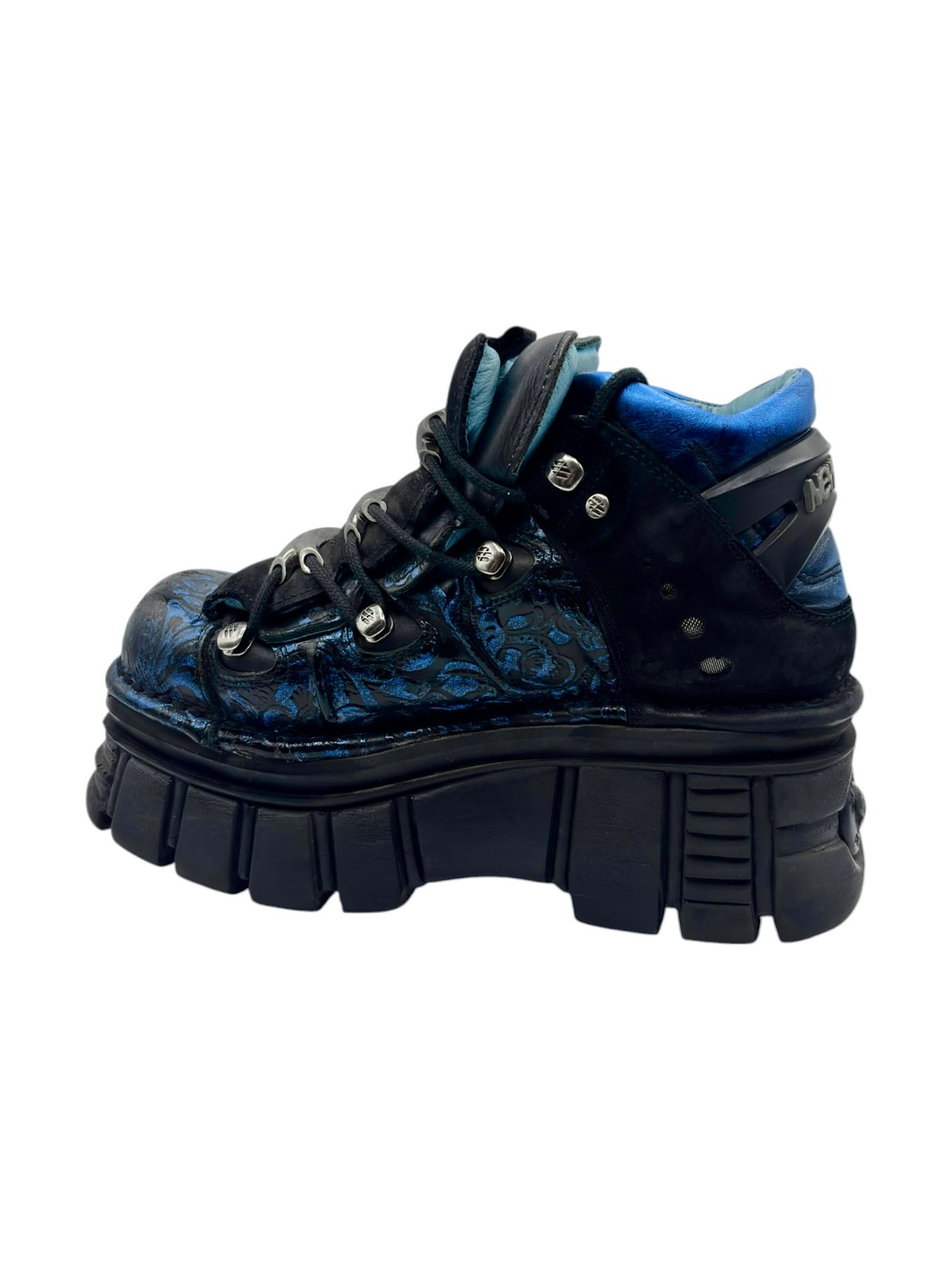Blue patterned lace-up platform boots with black panels and high-traction tread