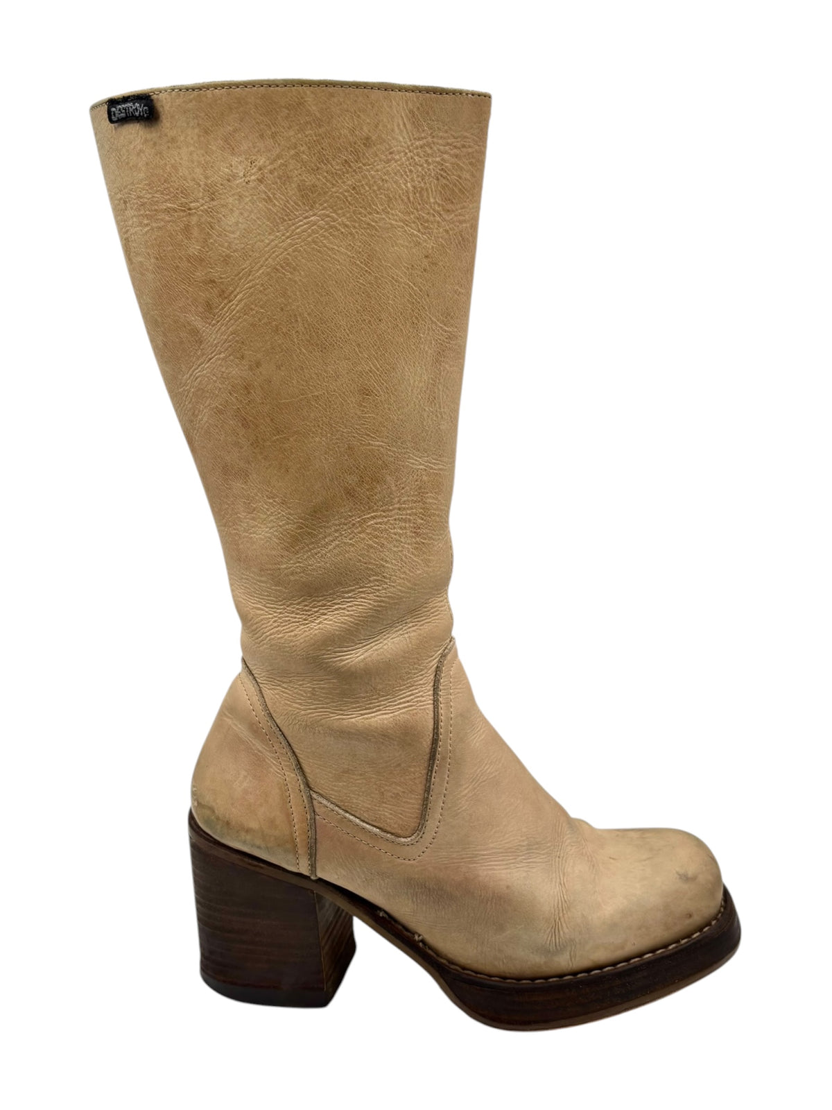 Beige knee-high leather boots with dark rubber sole and stacked block heel view.