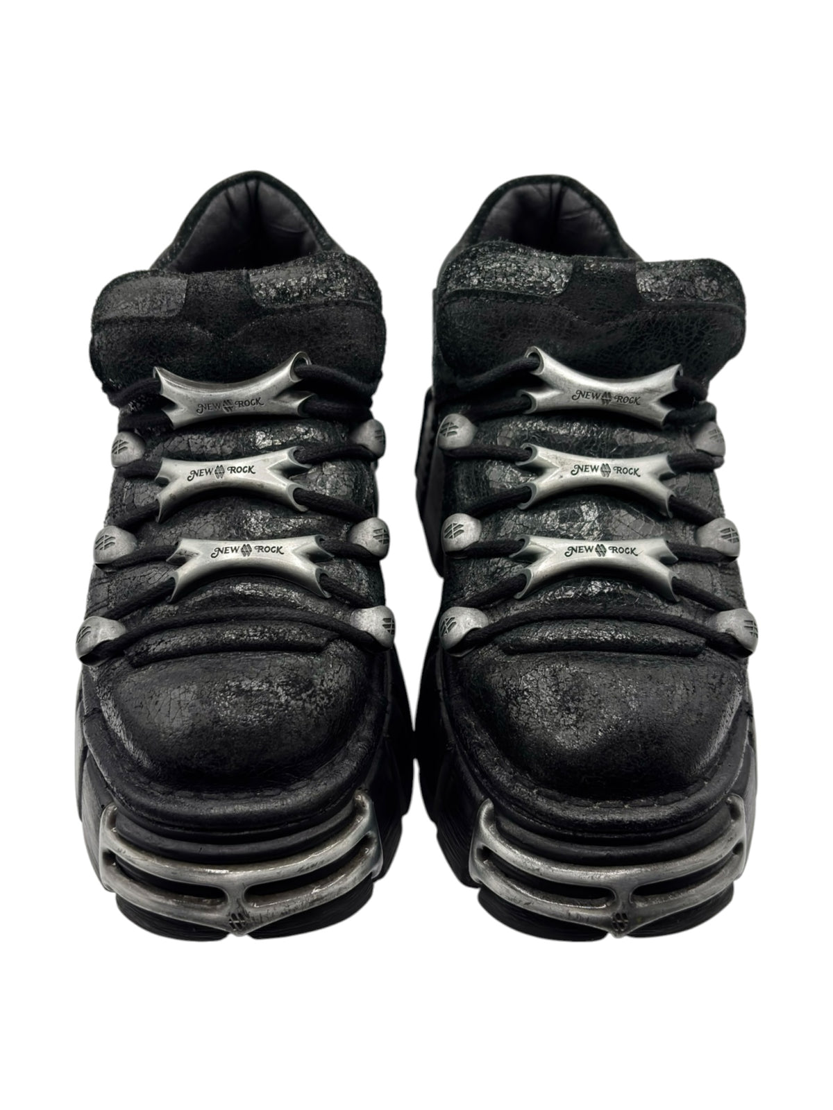 Black platform boots top rear view with silver logo and layered tread sole