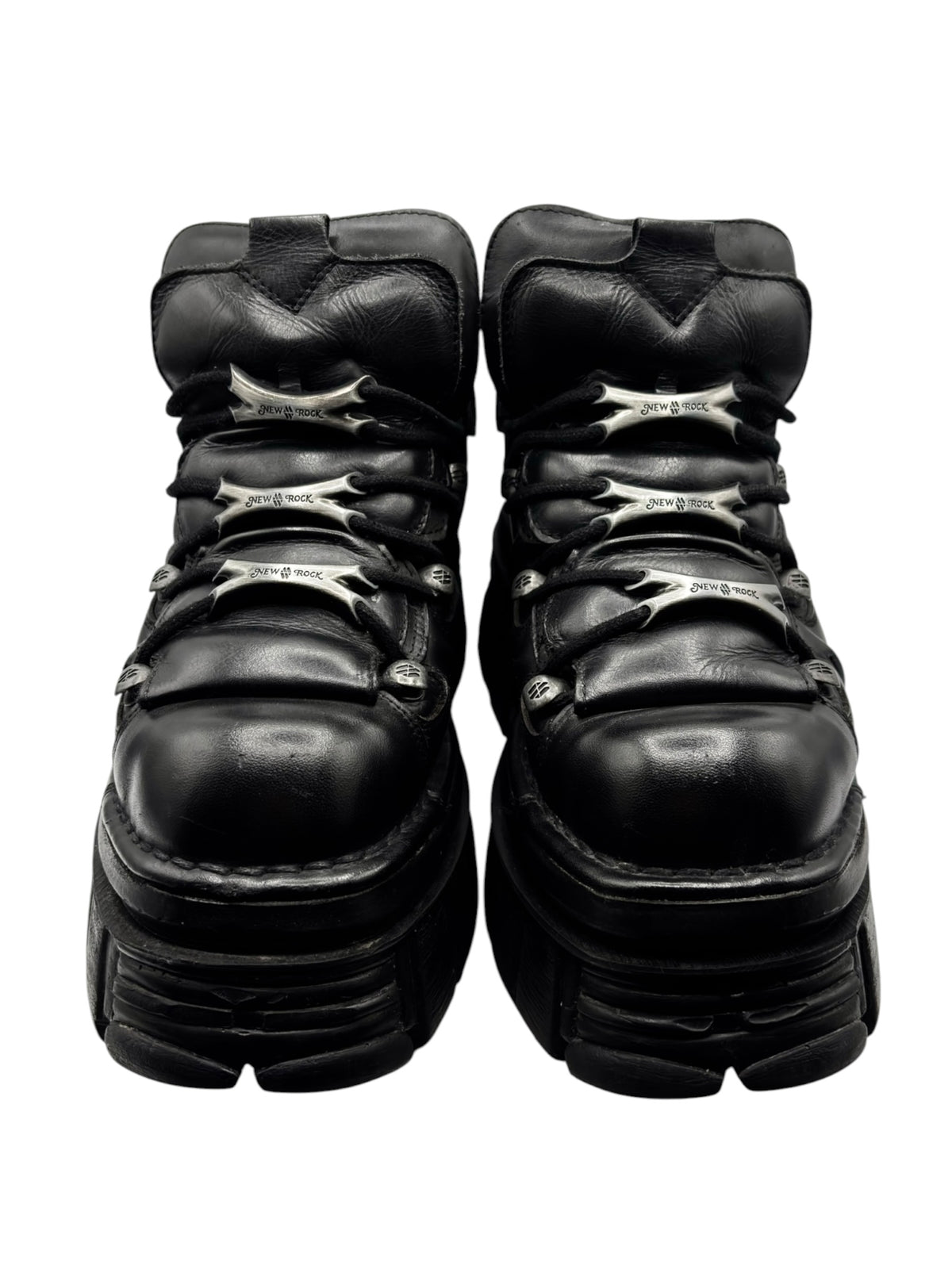 Black platform boots rear view with side straps and thick stacked sole