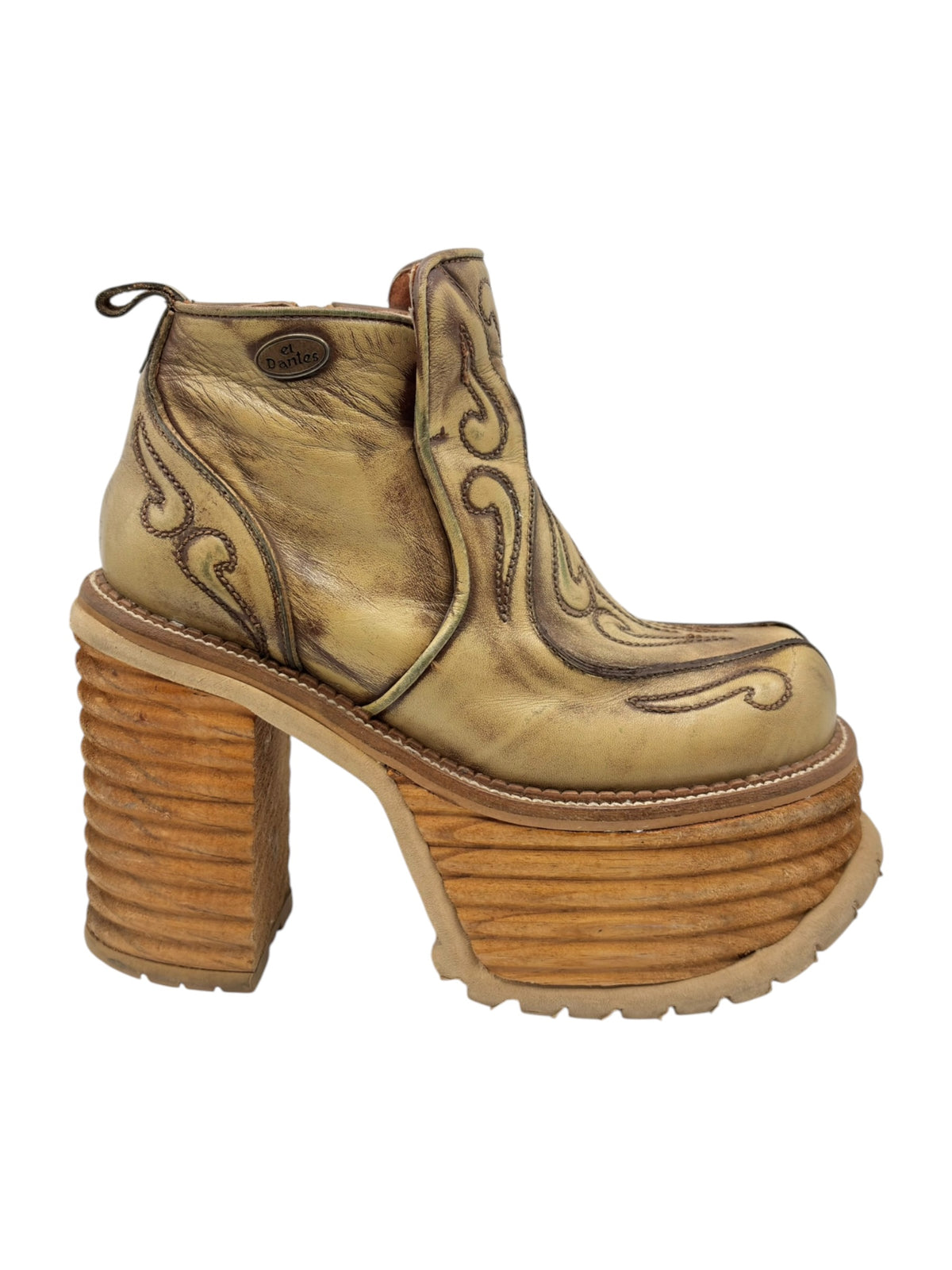 Khaki brown leather ankle boots with carved swirl motifs and chunky platform sole