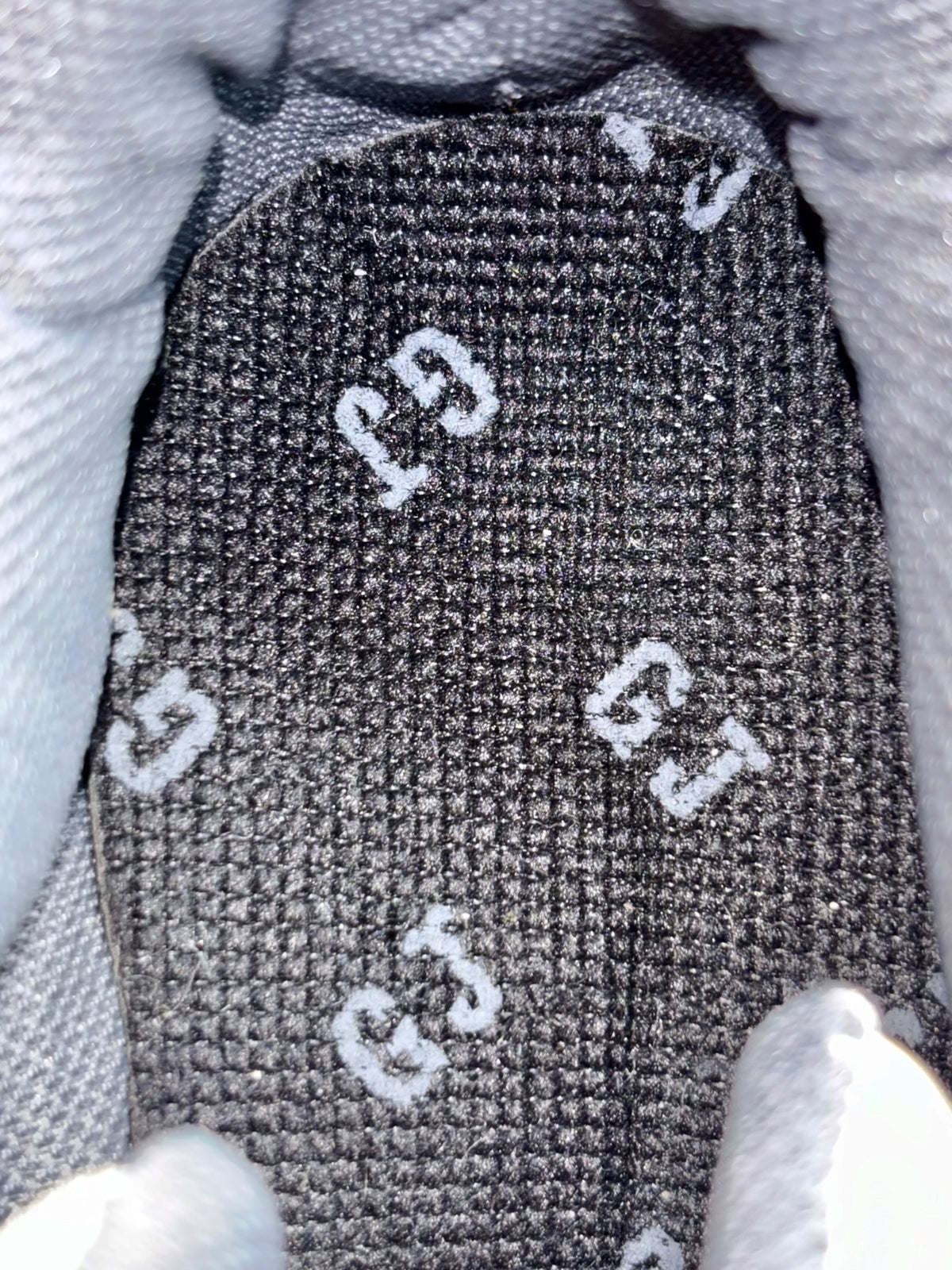 Dark textured knit upper with white graphic accents on vintage platform sneakers