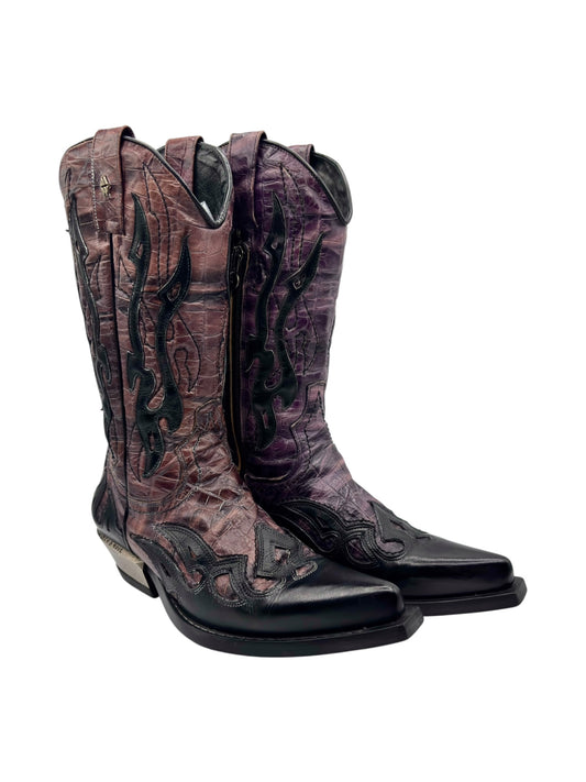 Angled view of cowboy boots with purple and brown flame patterns and black soles