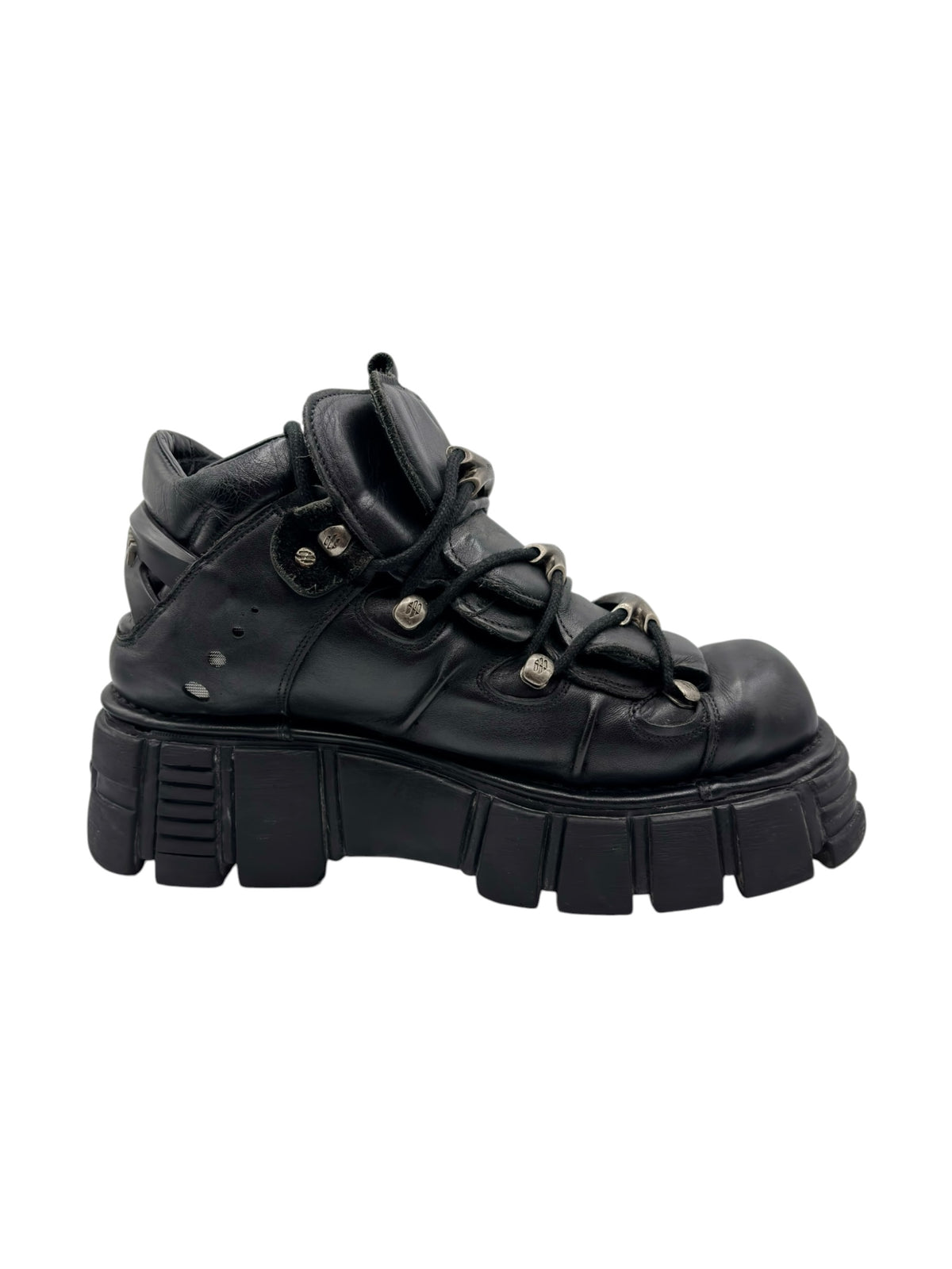 Black lace-up platform boots with chunky outsole and decorative metal hardware
