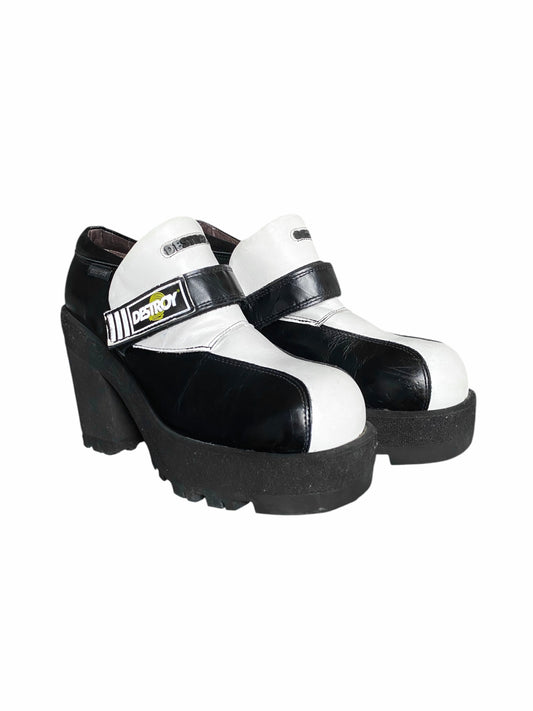 Black-and-white leather platform loafers with thick sole and strap