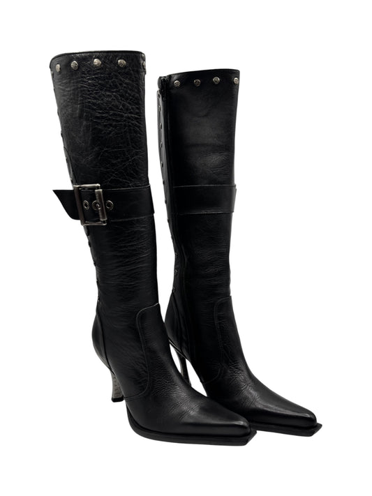 Black knee-high leather heeled boots with strap buckle detail
