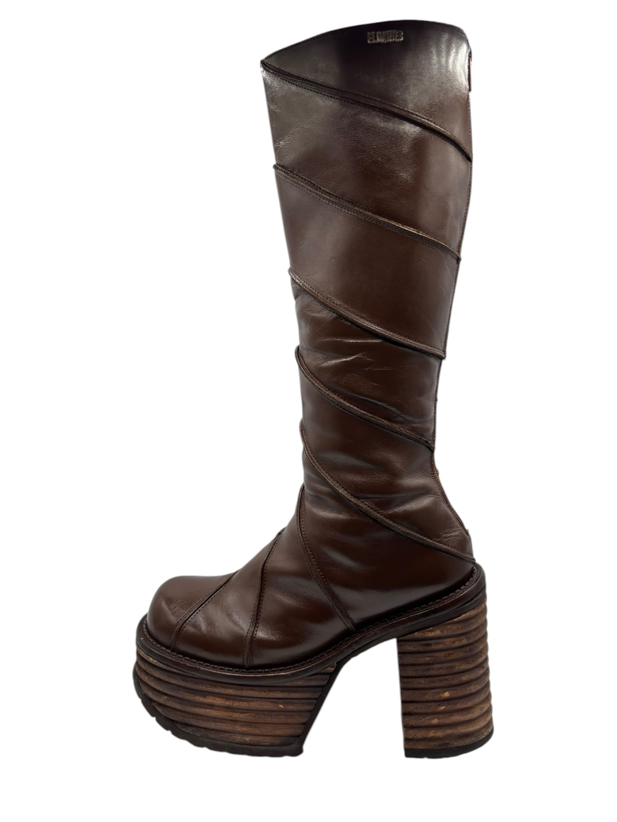 Brown knee-high platform boots with sculpted straps and stacked wood-look heel