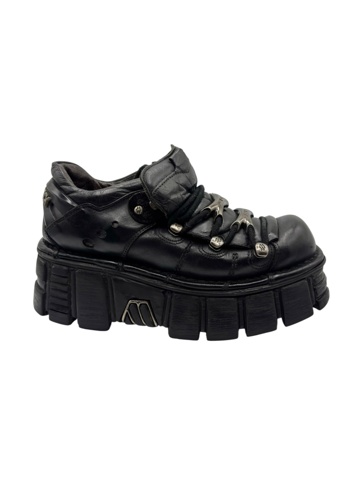 Vintage black platform boots, lace-up uppers and chunky lug sole with molded side ridges.