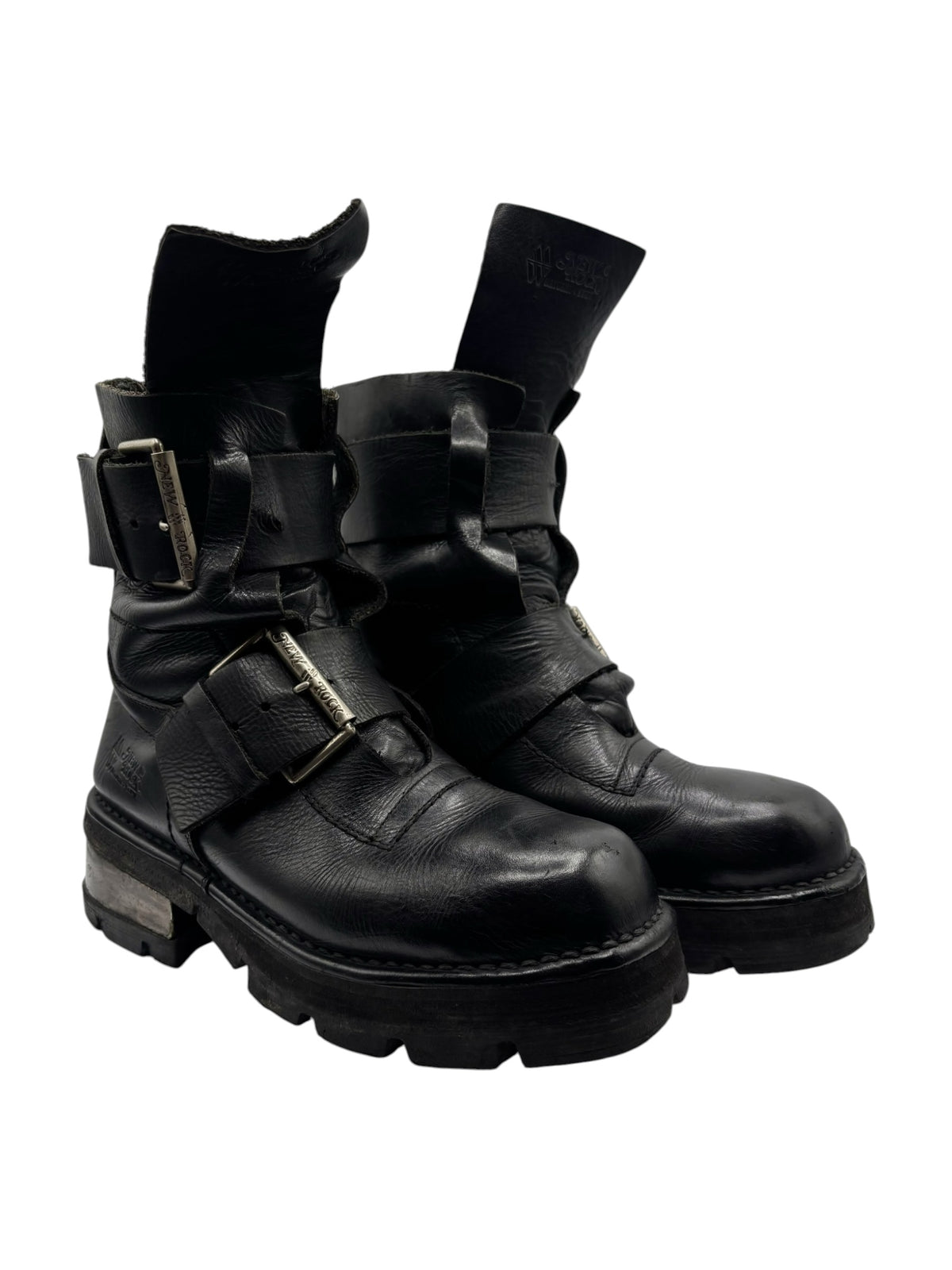 Black leather buckle boots with strap detail and lugged outsole, low heel